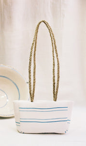 “The white retxat bag”
